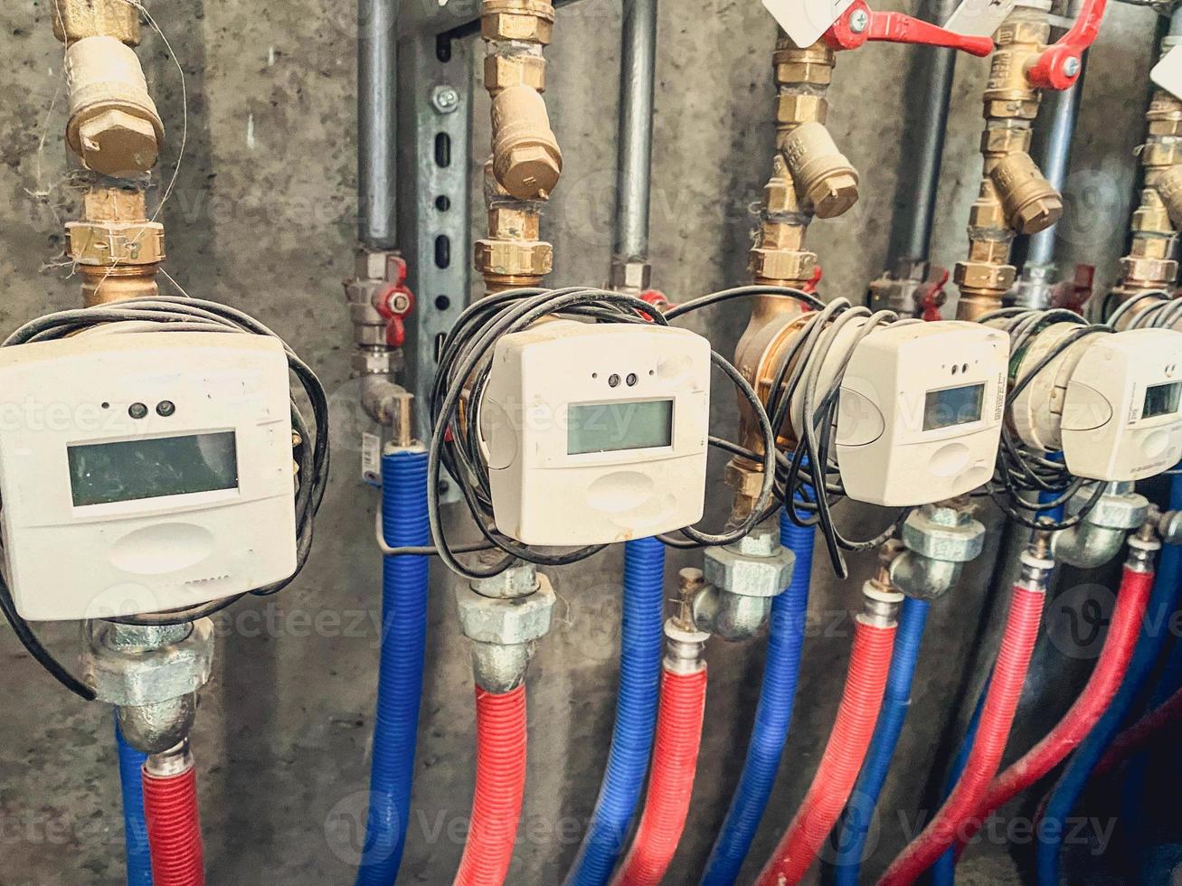 meters in a residential, apartment building for measuring heat energy. expenditure of energy resources in the house for residents. apartment for living photo