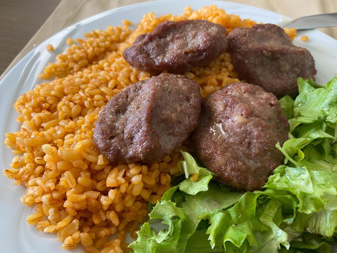 Cutlets from minced meat and rice photo