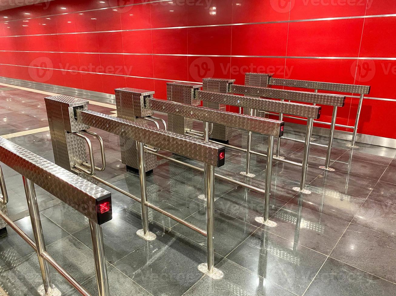 Automatic barriers for control people entered in railway station or in metro, red light show for no entrance, necessary tickets, new technologies in habitual life, automatic open and close doors photo