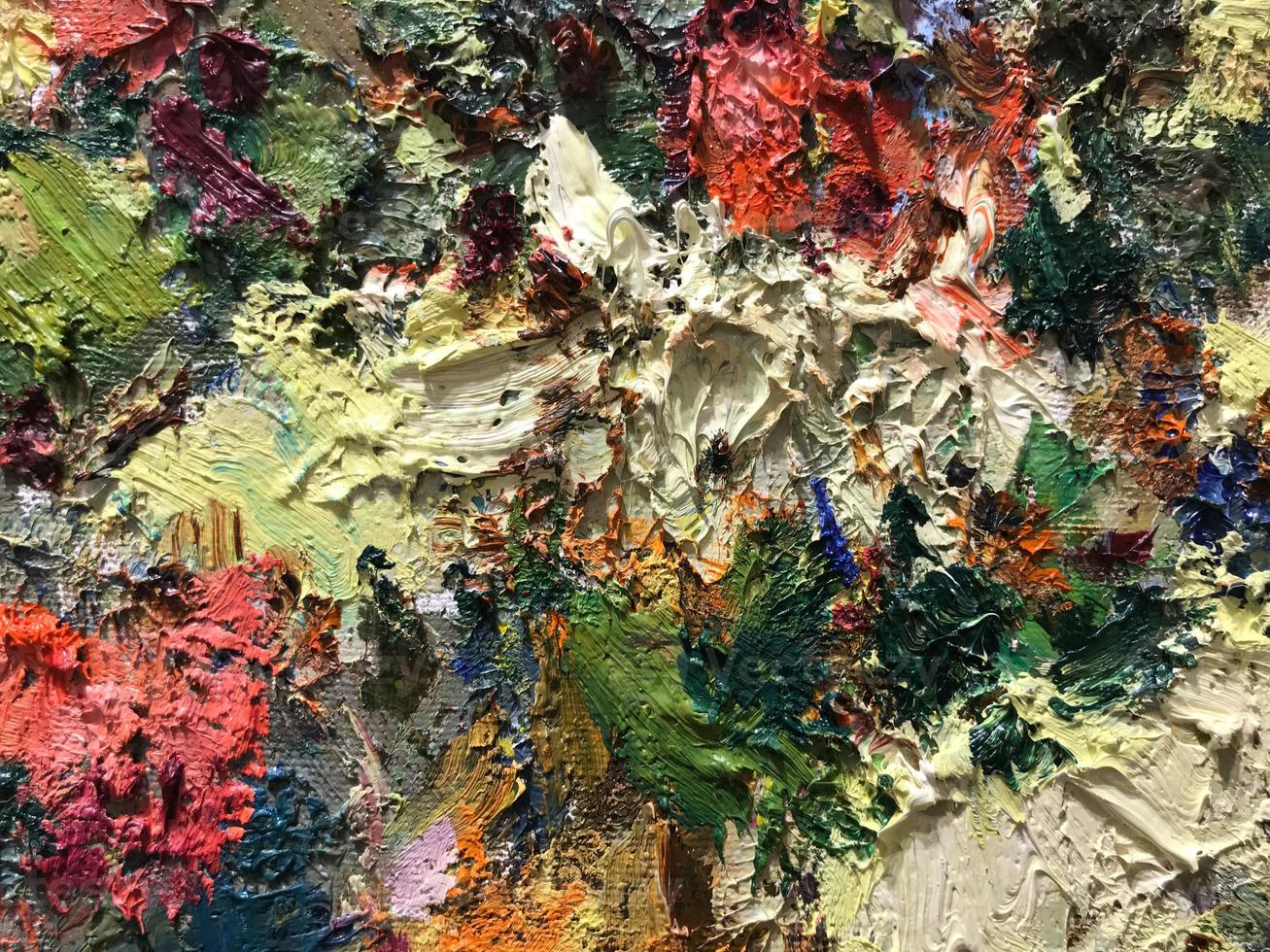 Textured background of multi-layer flaking paint on the wall. Mixing different colors of paints in the cleaved layers on the surface. Grunge texture with a deep pattern photo