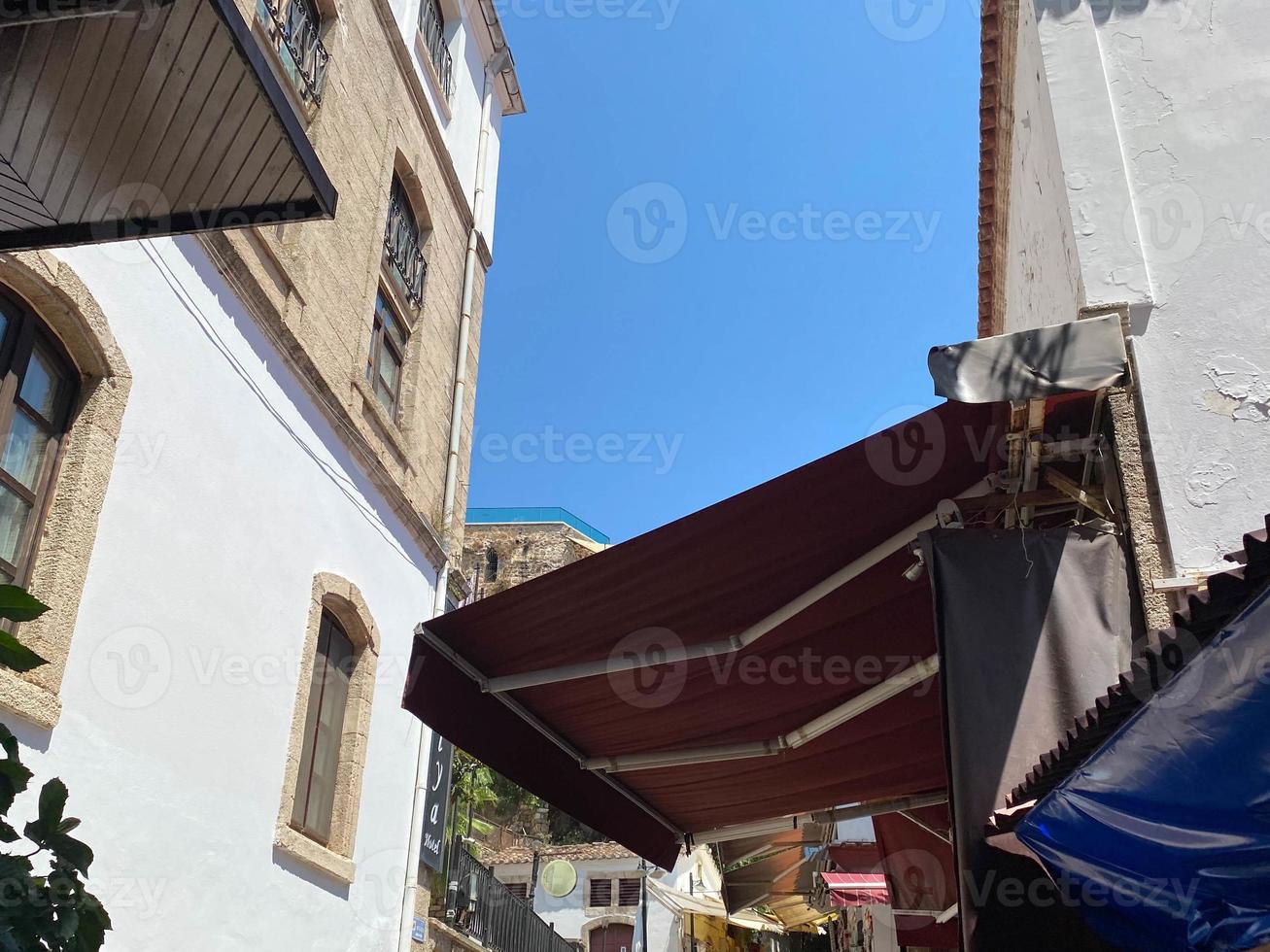 Building architecture in old town of Split. Rooftops with communications photo