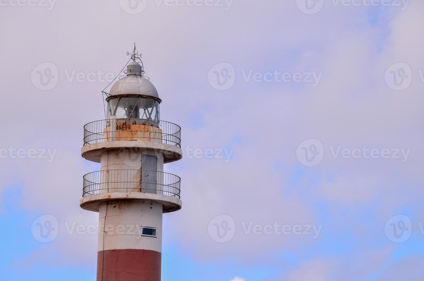 Lighthouse by the sea photo