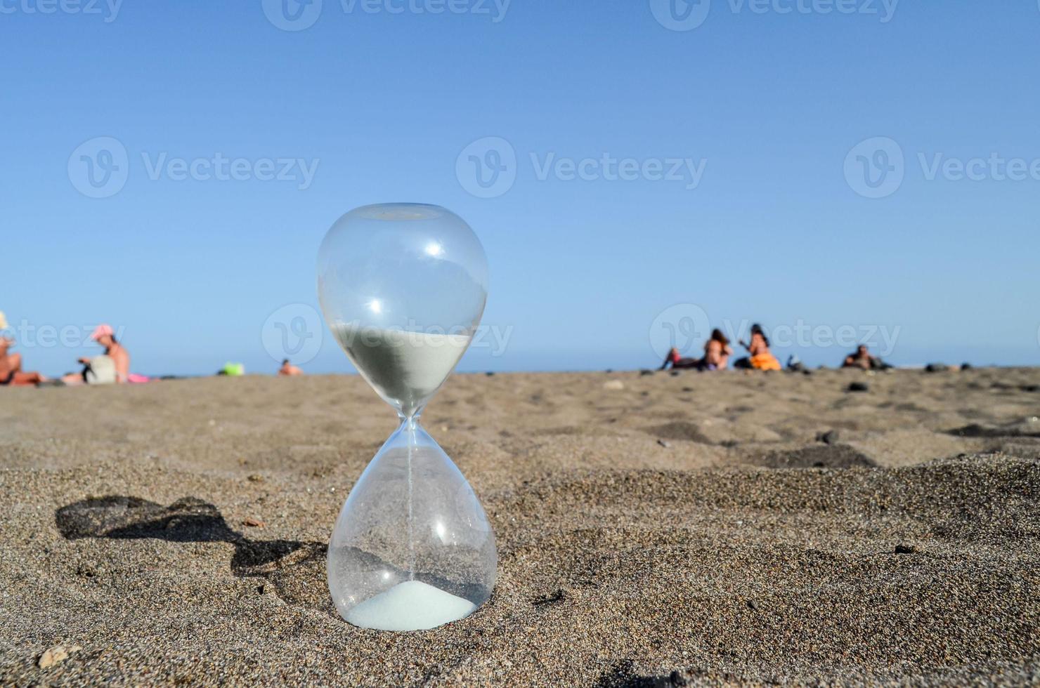 Hourglass on the ground photo