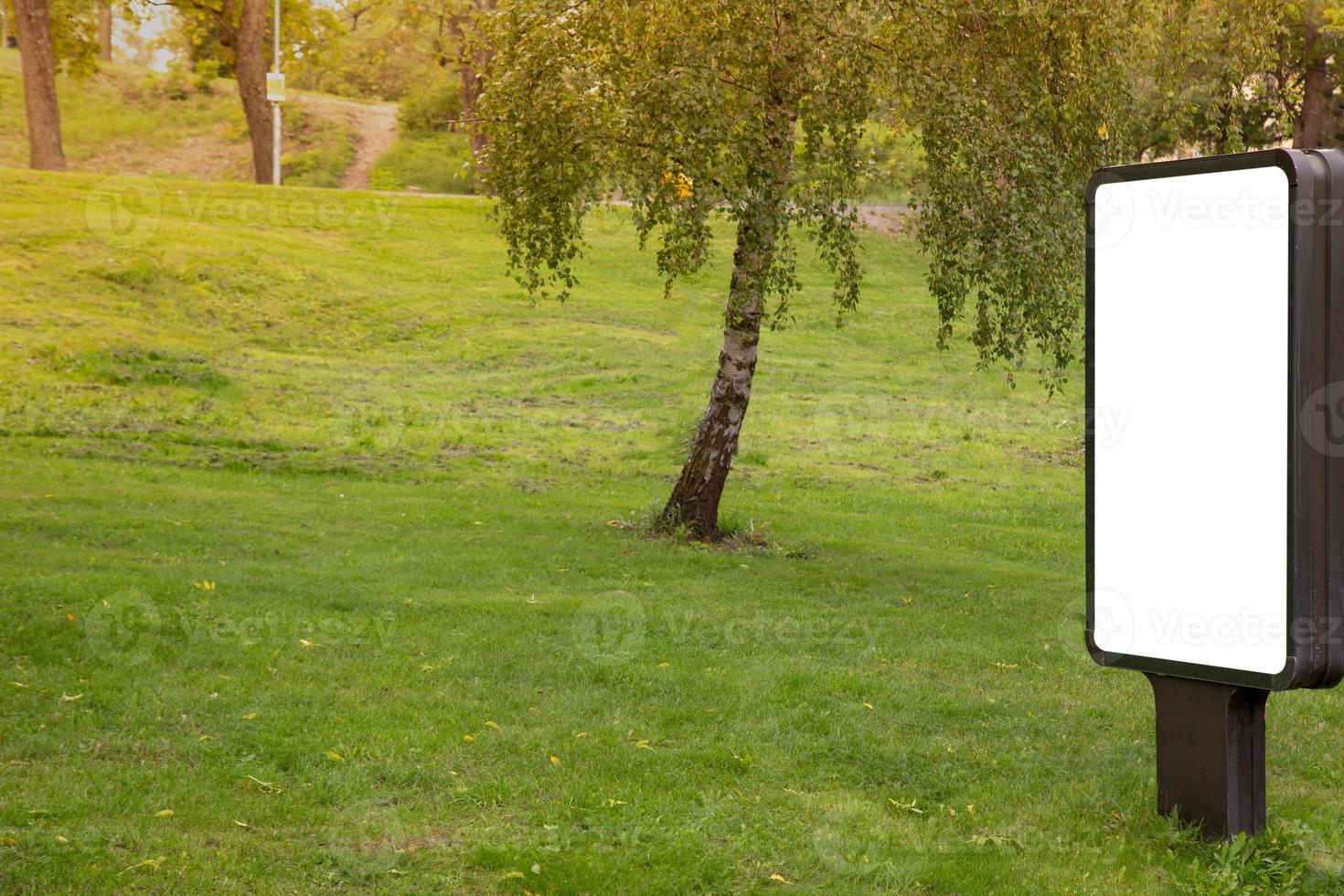 Blank billboard mock up on public park for text message or content. photo