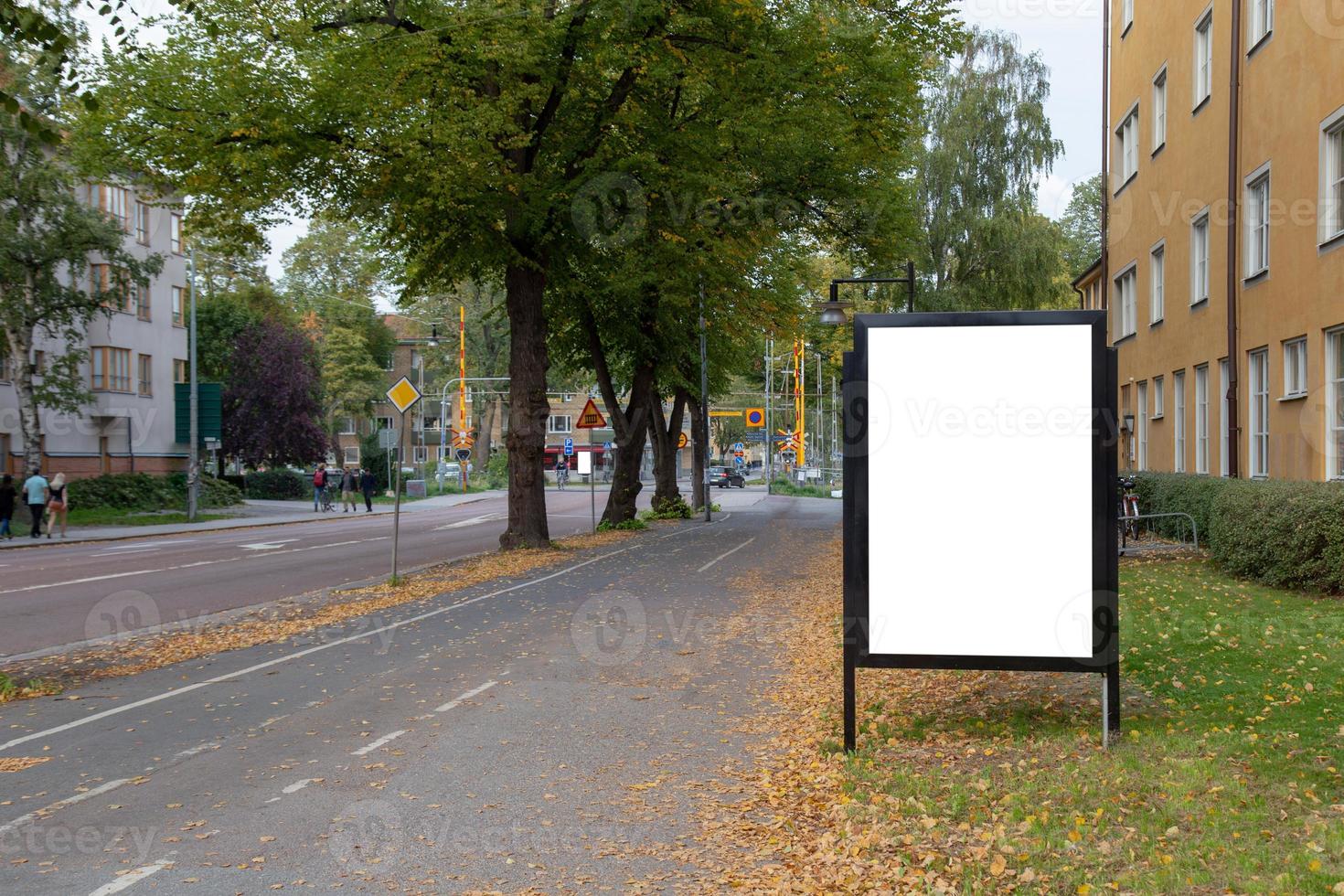 Blank billboard mock up on city road for text message or content. photo