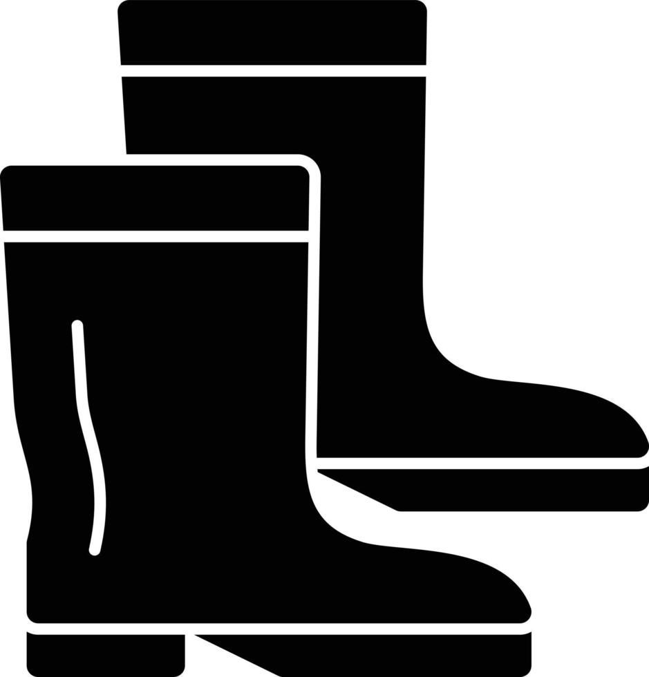 icono de glifo de botas vector