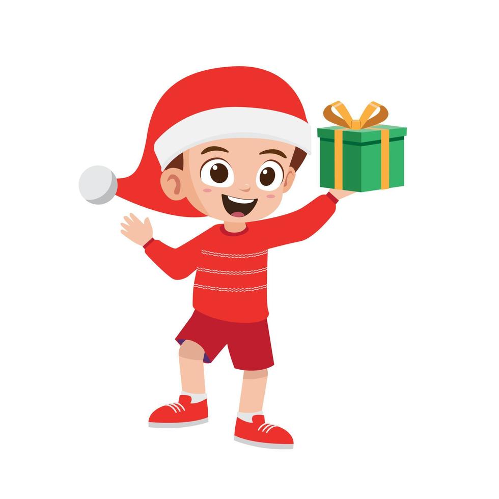 niño pequeño lindo feliz que sostiene el regalo para la Navidad vector