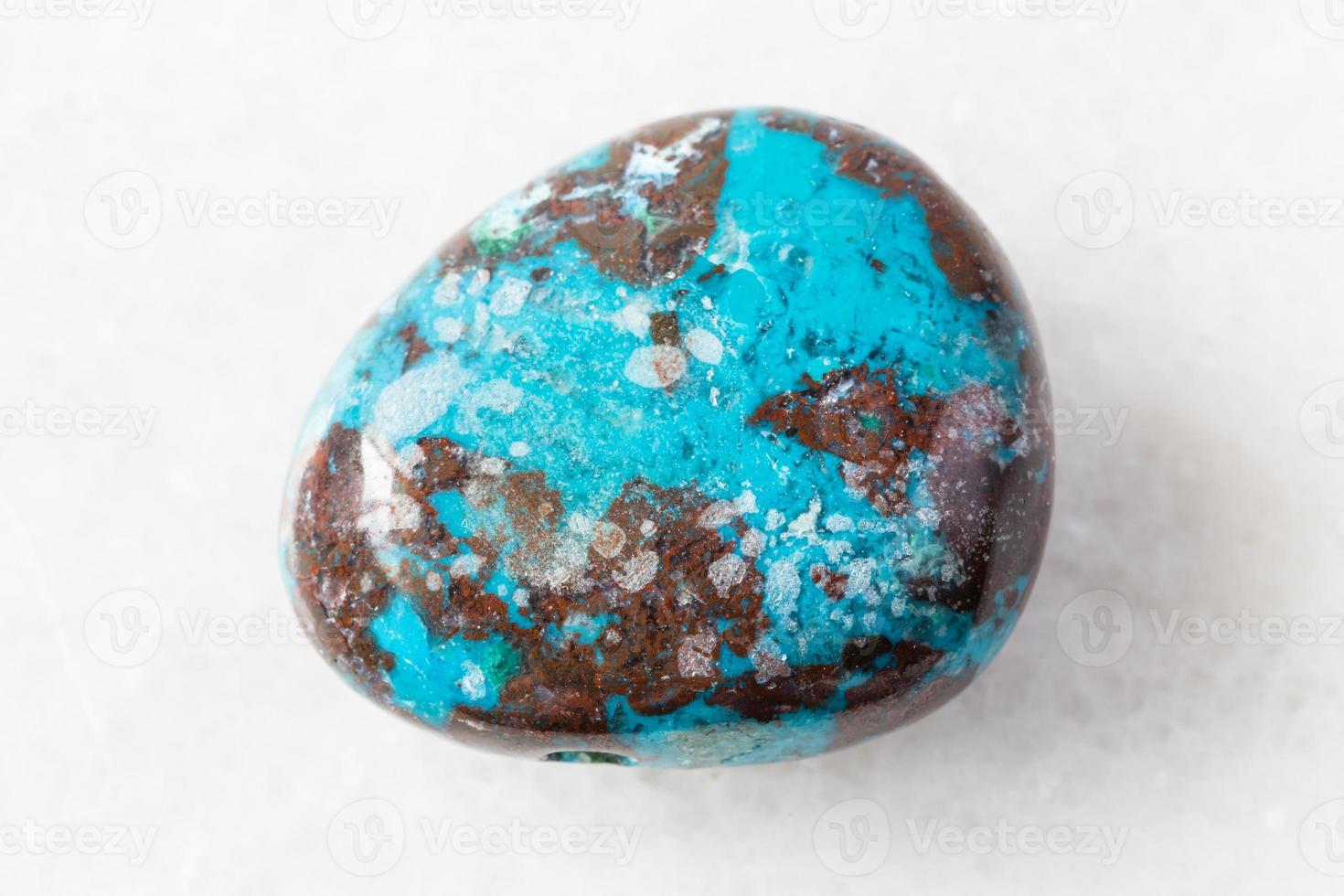 polished Chrysocolla with Cuprite rock on white photo