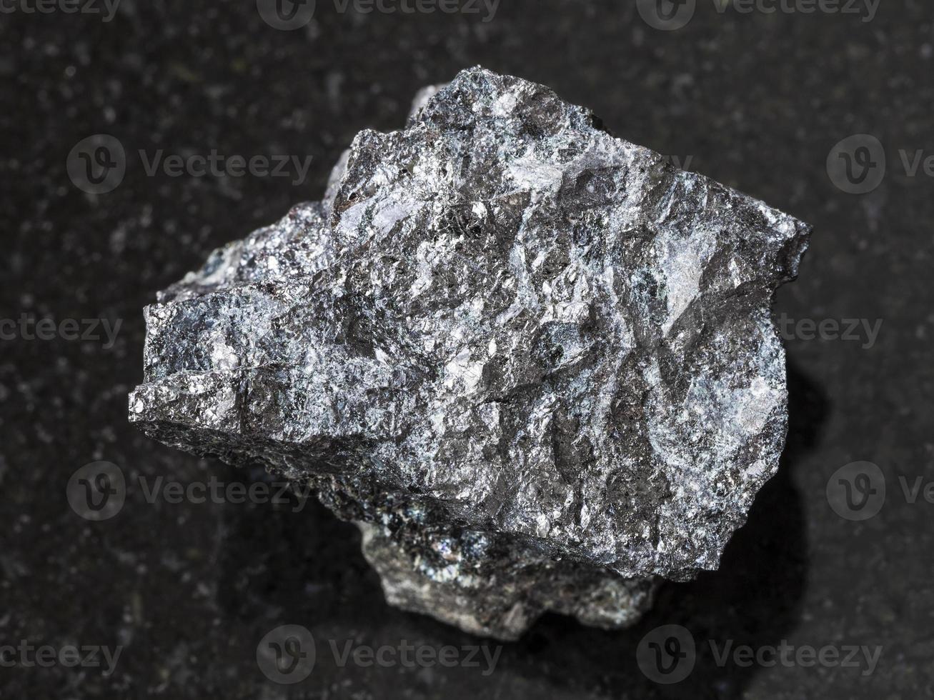 rough Magnetite ore on dark background photo