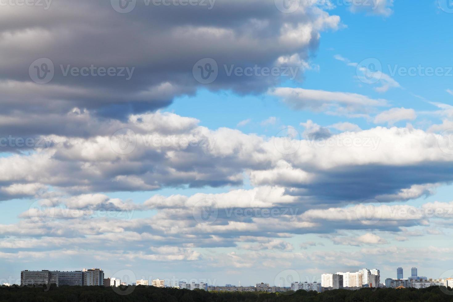 shadow of grey clouds on urban street in spring photo