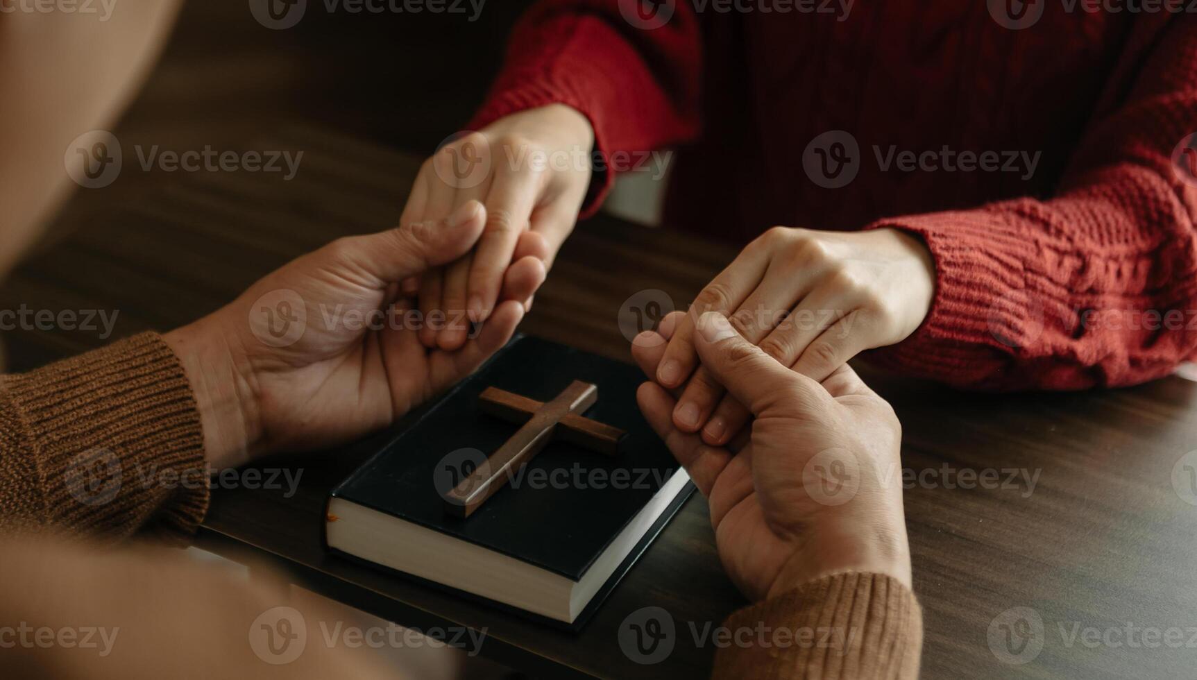 Two people reading and study bible in home and pray together.Studying the Word Of God photo