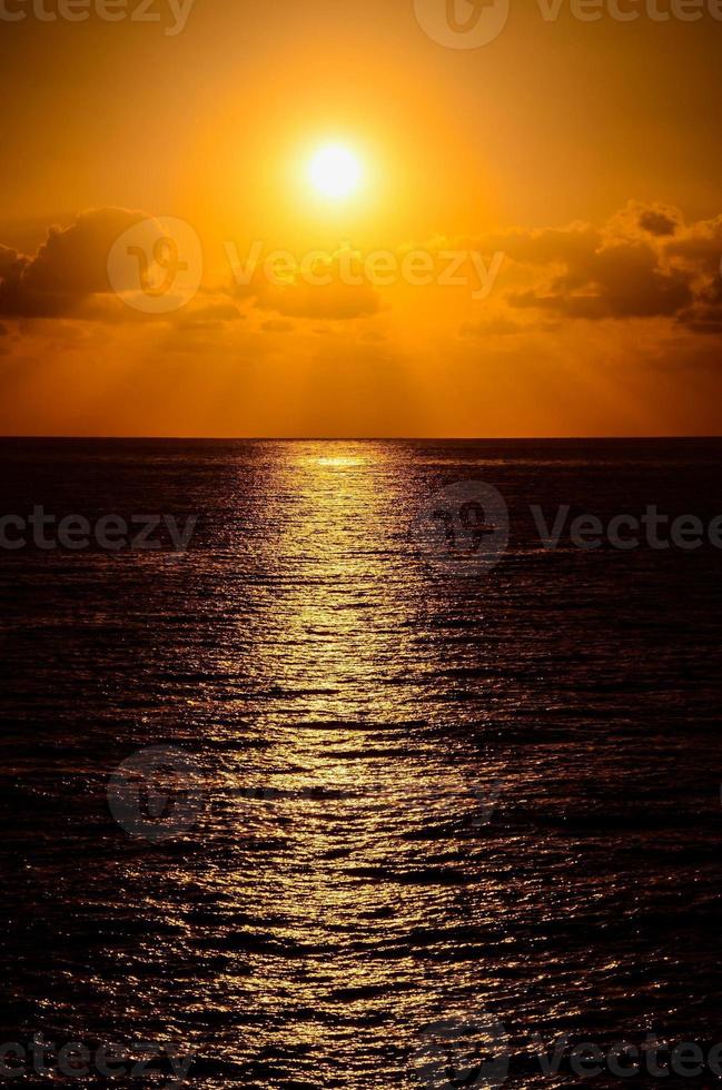 Sunset over the ocean photo