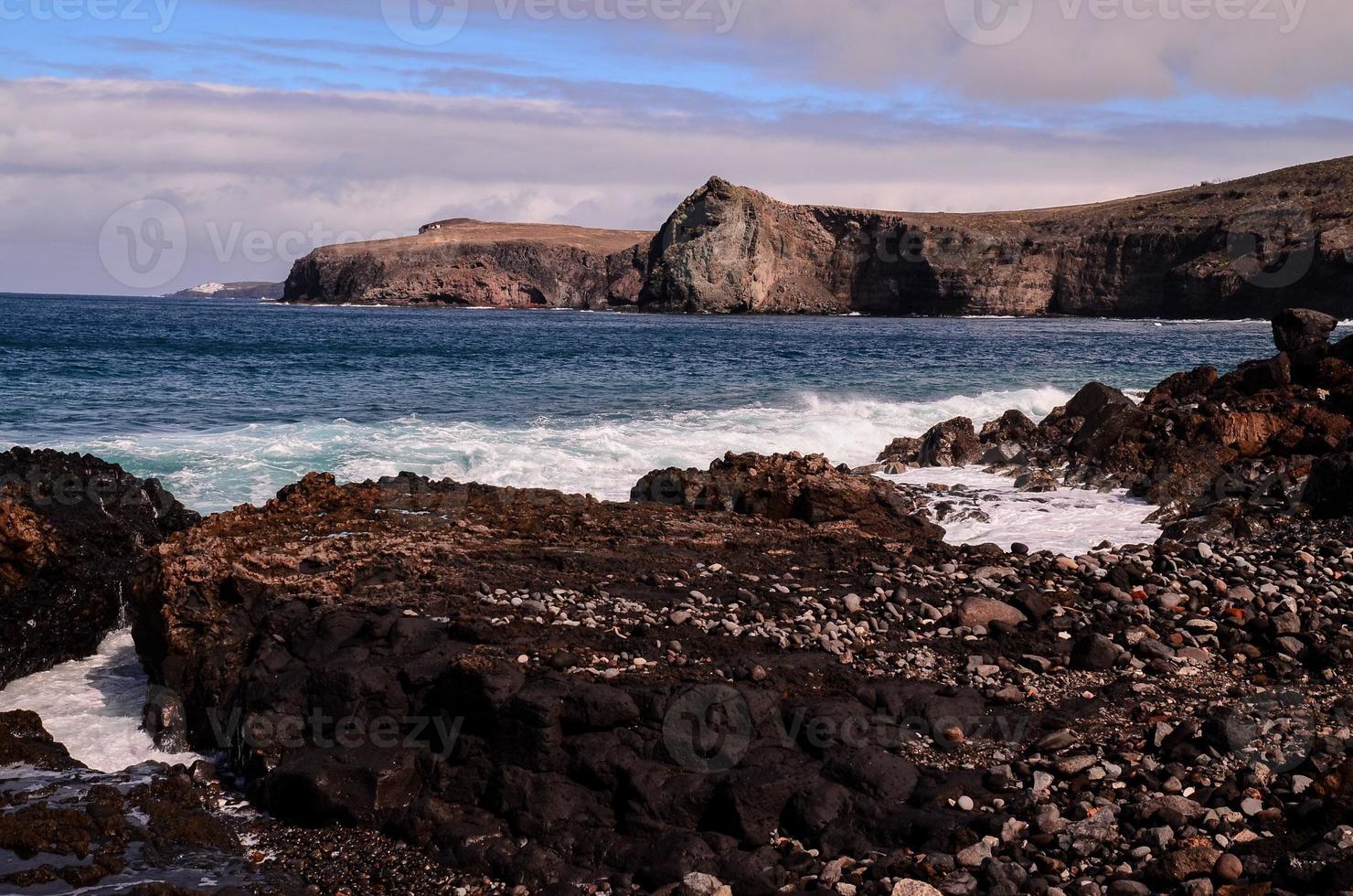 Rocky shoreline in summer photo