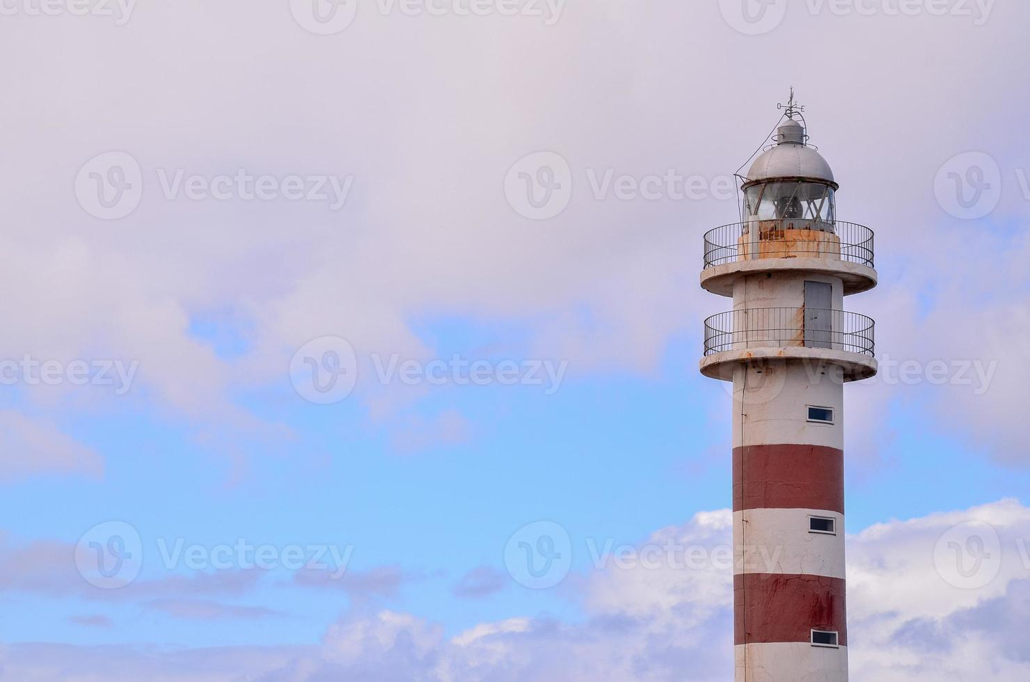 Lighthouse by the sea photo