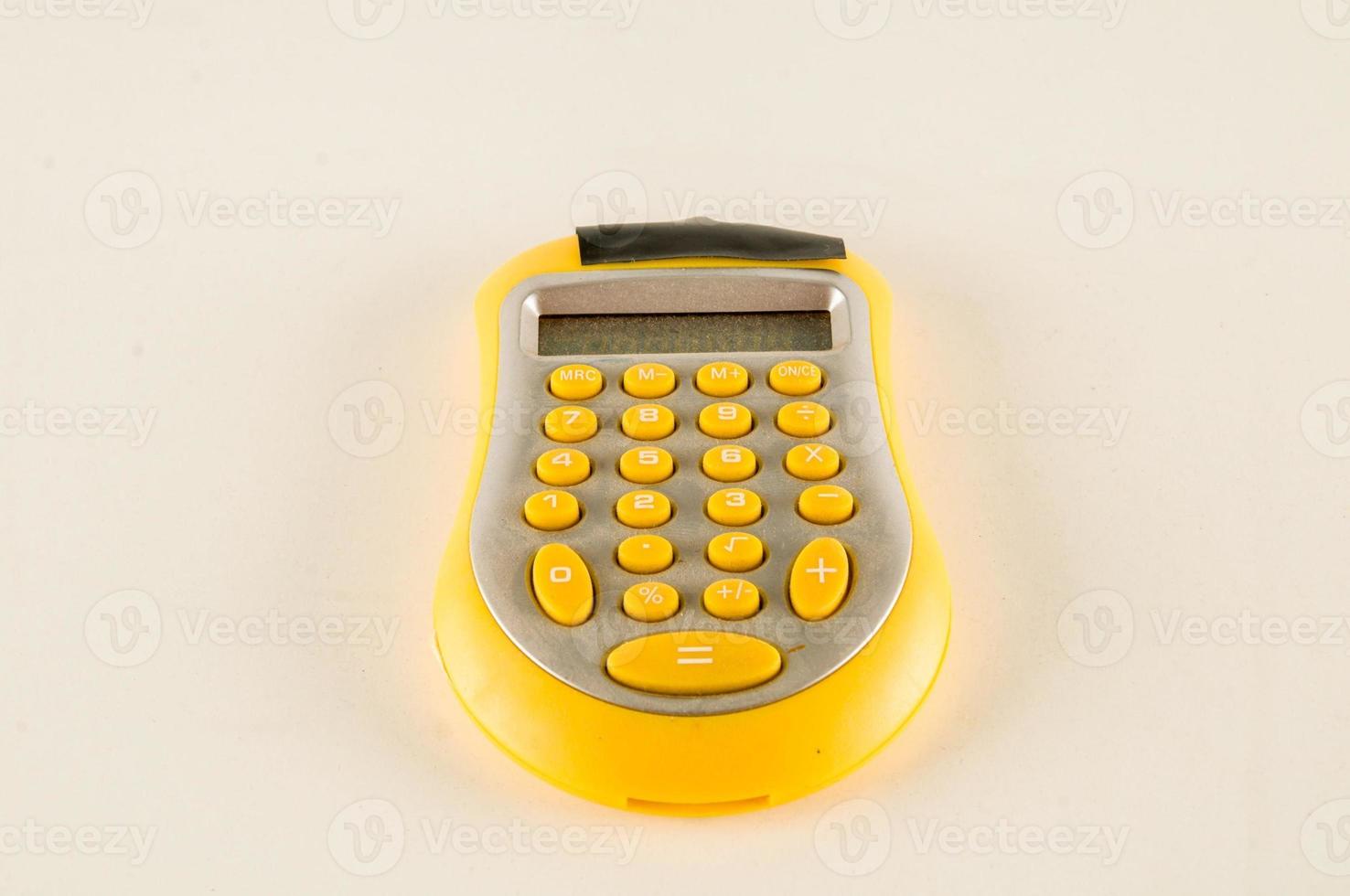 Yellow calculator closeup photo