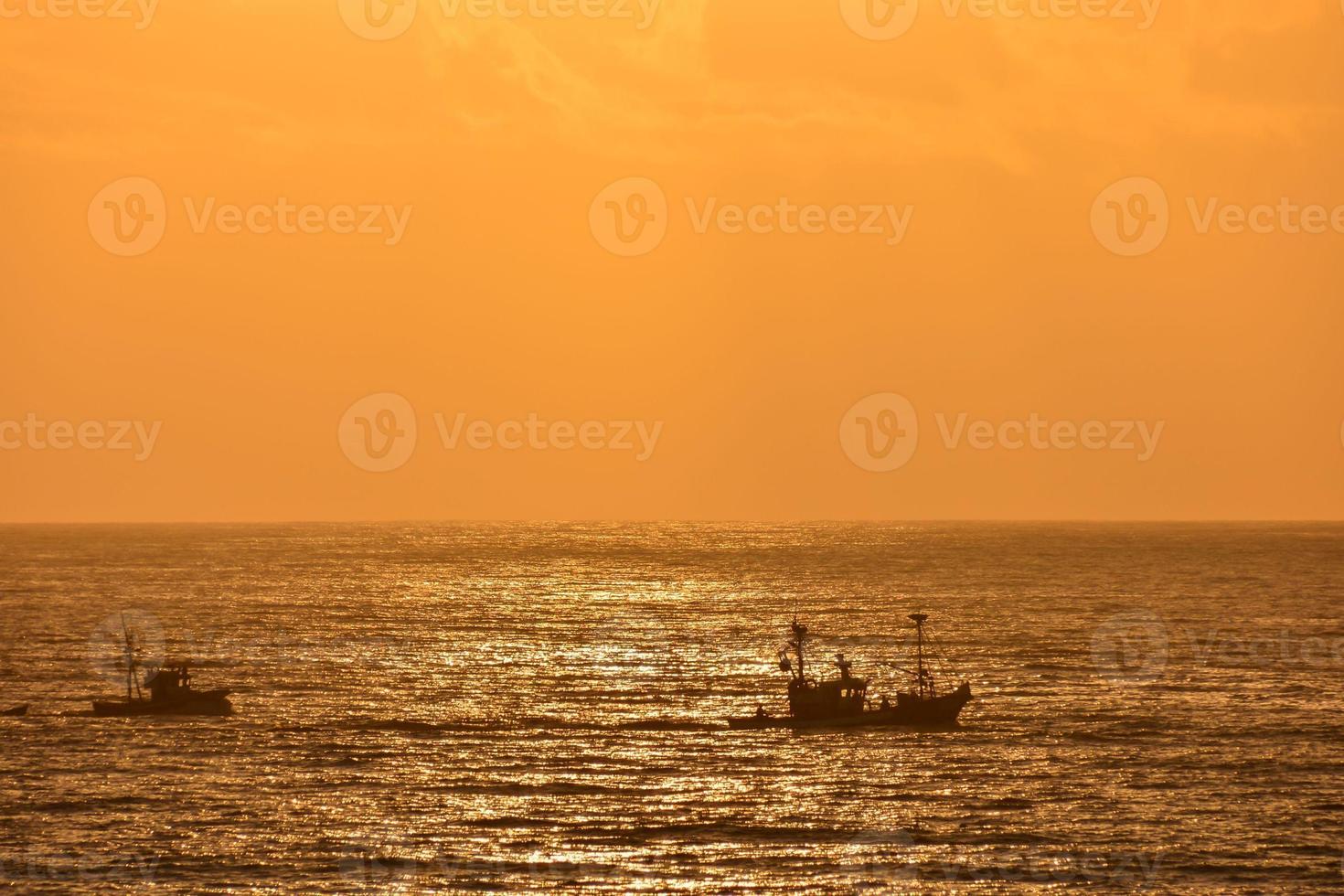 Sunset over the ocean photo