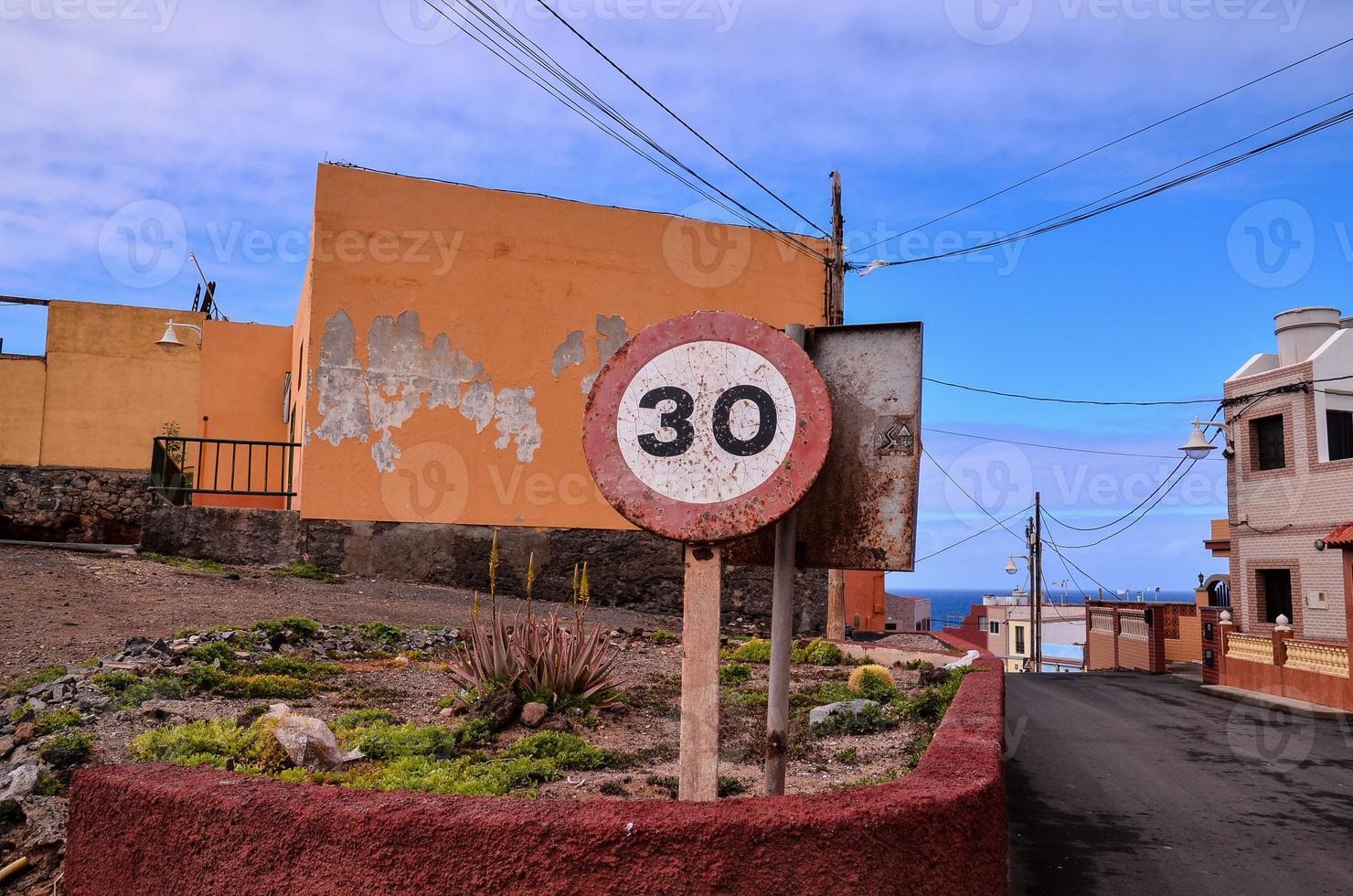 Corroded traffic signs on the street photo