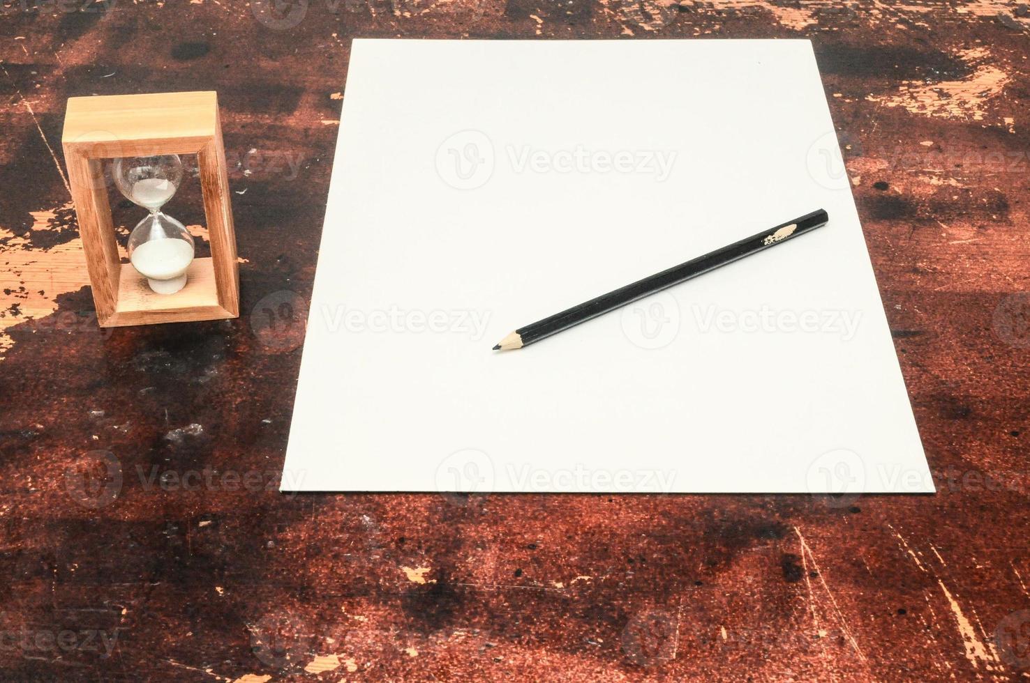 Hourglass and paper photo