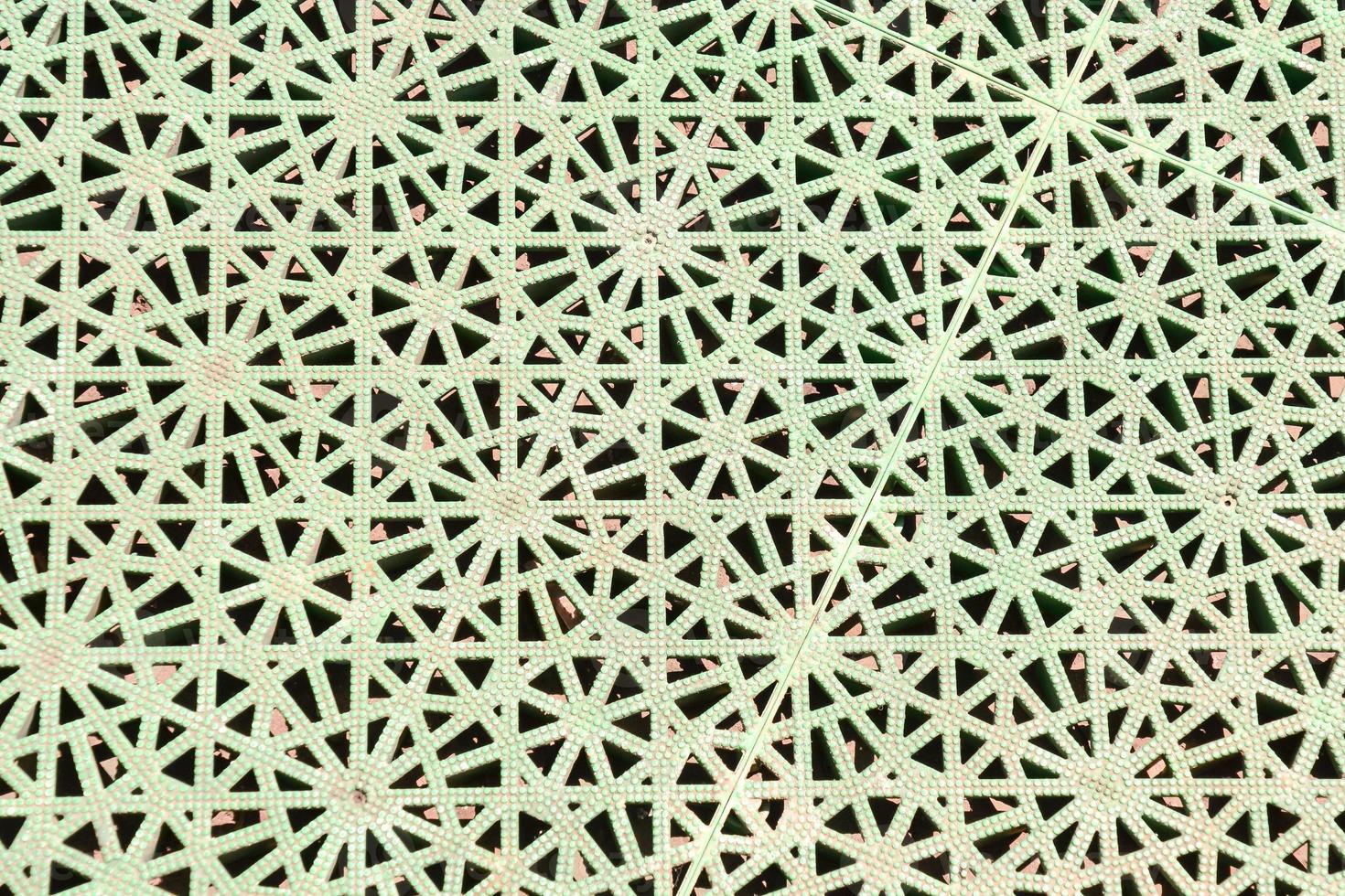 Green metal with geometric pattern photo