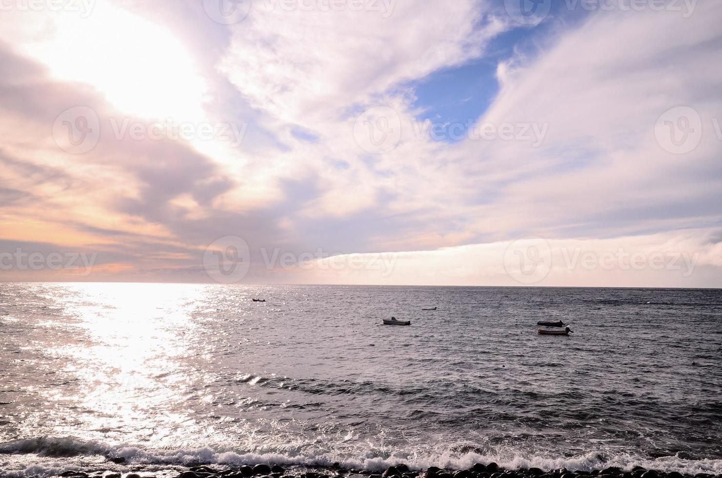 Sunset over the ocean photo