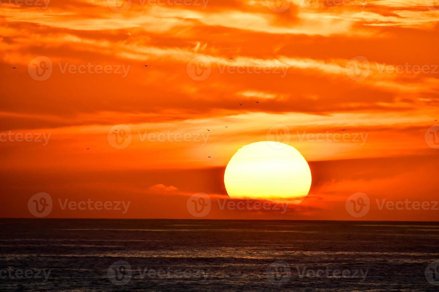 Sunset over the ocean in Morocco photo