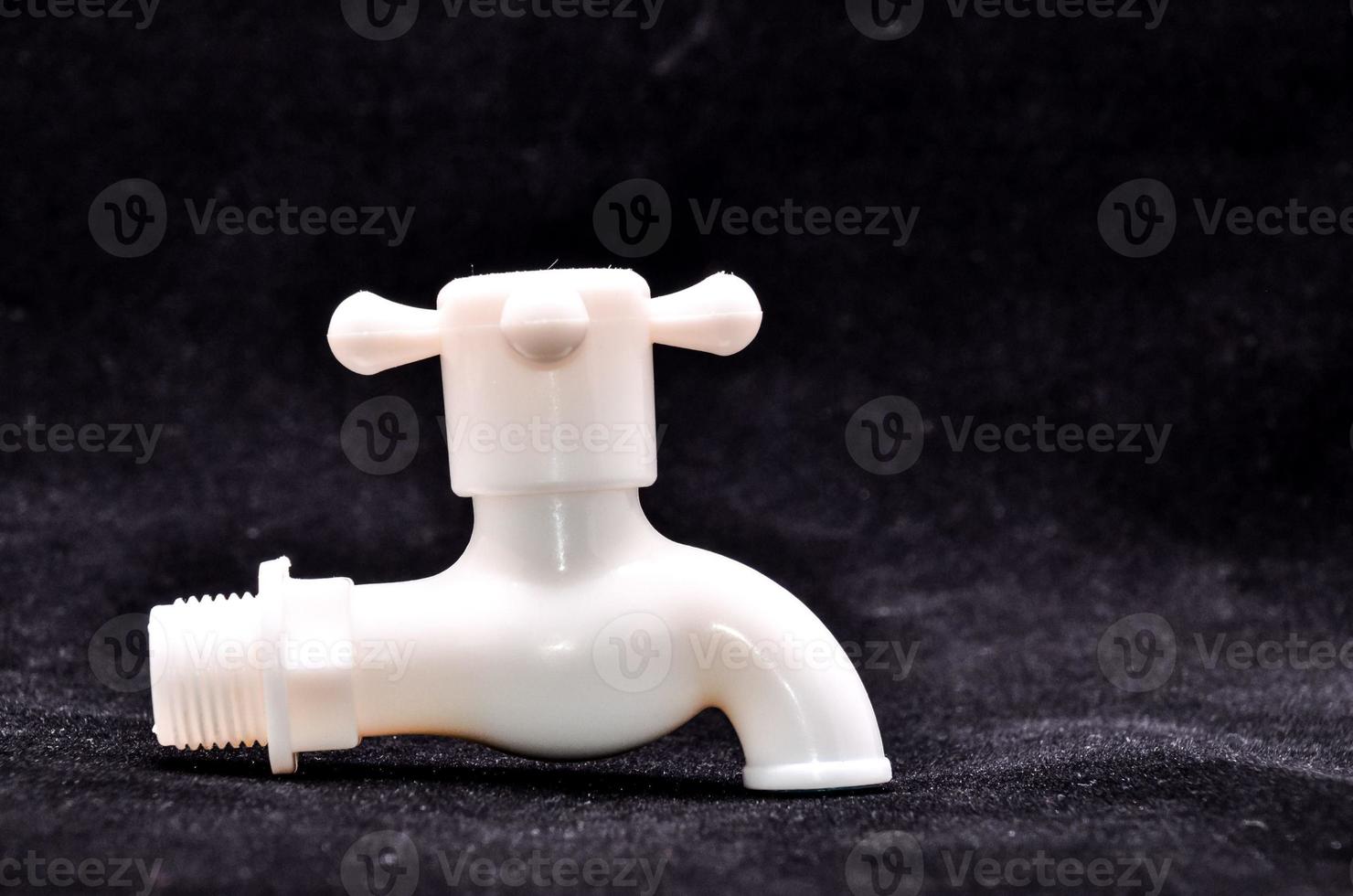 white plastic faucet crop-out photo