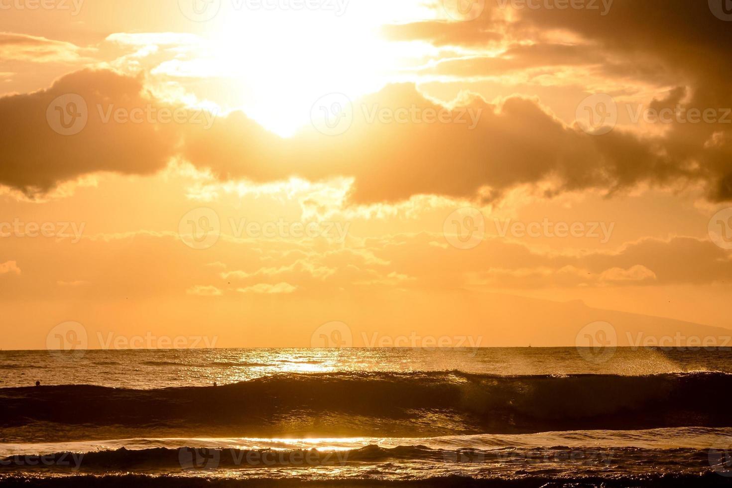 Sunset over the ocean photo