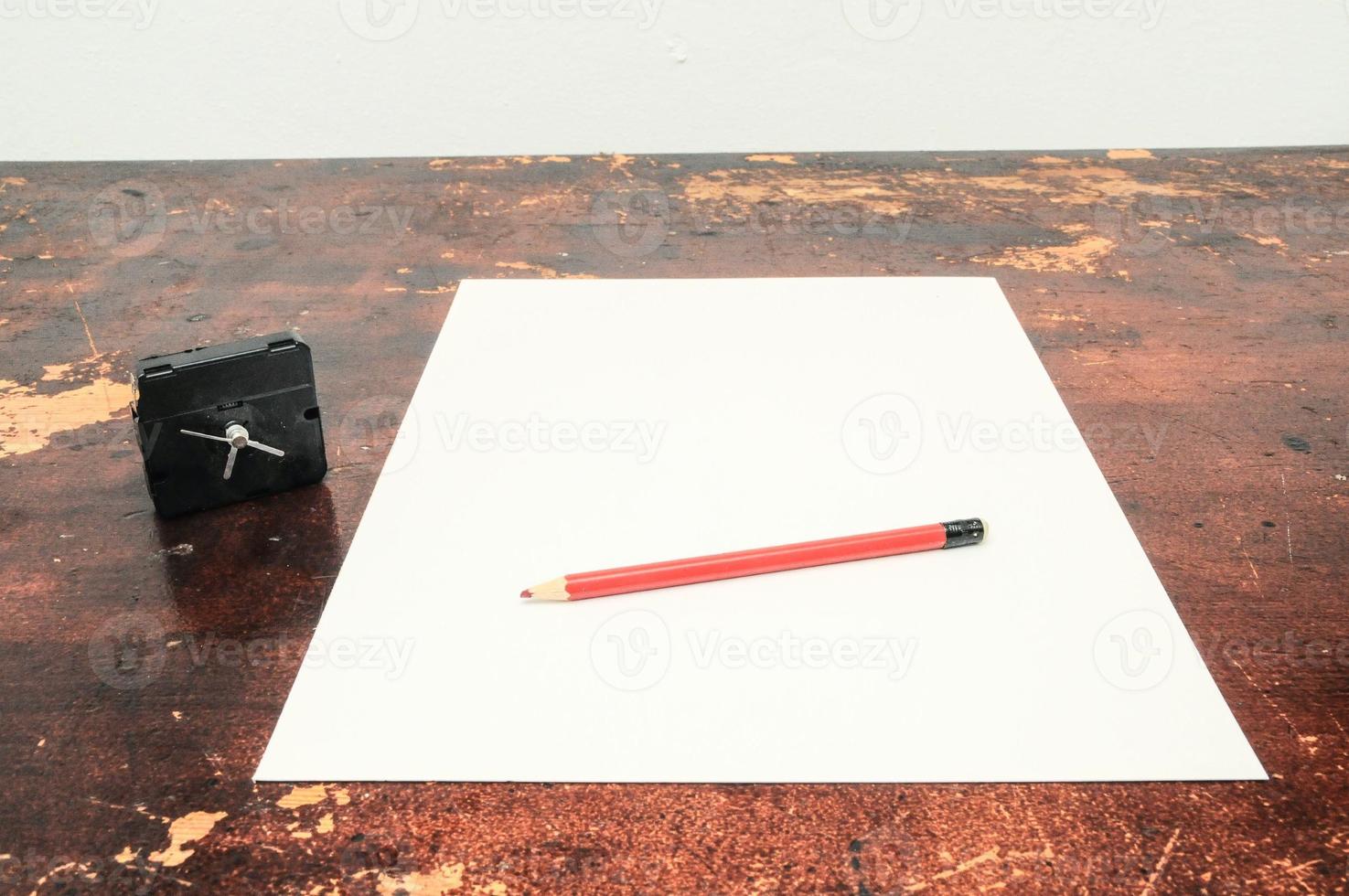 Paper and pencil on the table photo