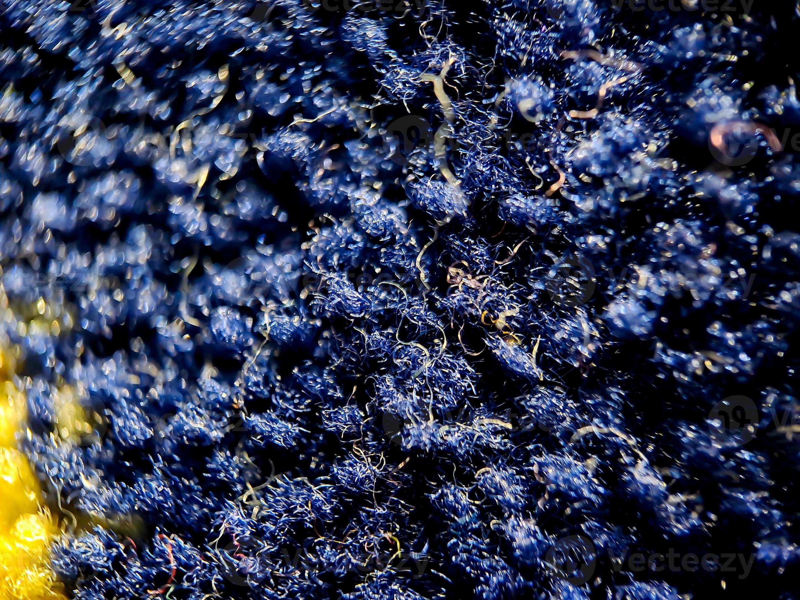the texture of the prayer rug in dark blue and gold. suitable for