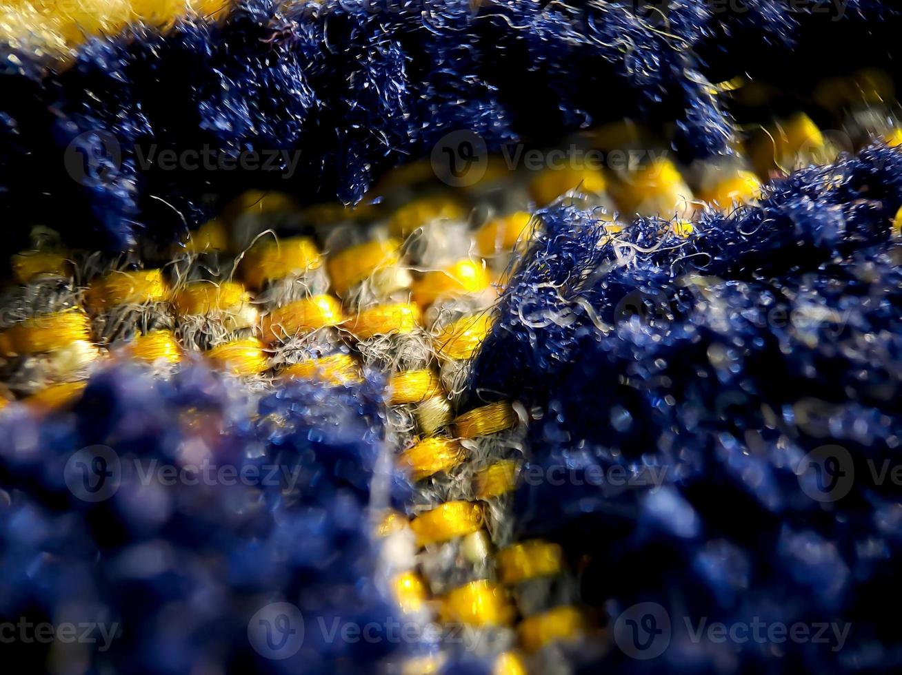 the texture of the prayer rug in dark blue and gold. suitable for wallpaper background. photo