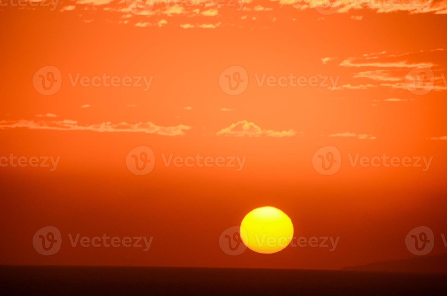 Sunset over the ocean photo