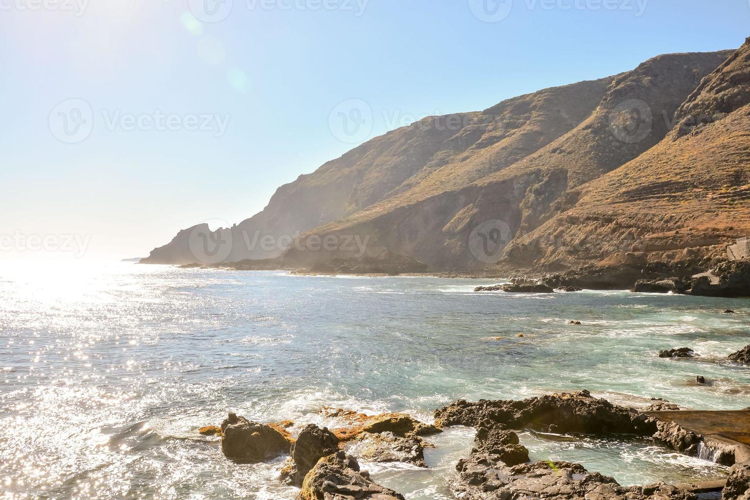 Waves hitting a rock scene 14786685 Stock Photo at Vecteezy