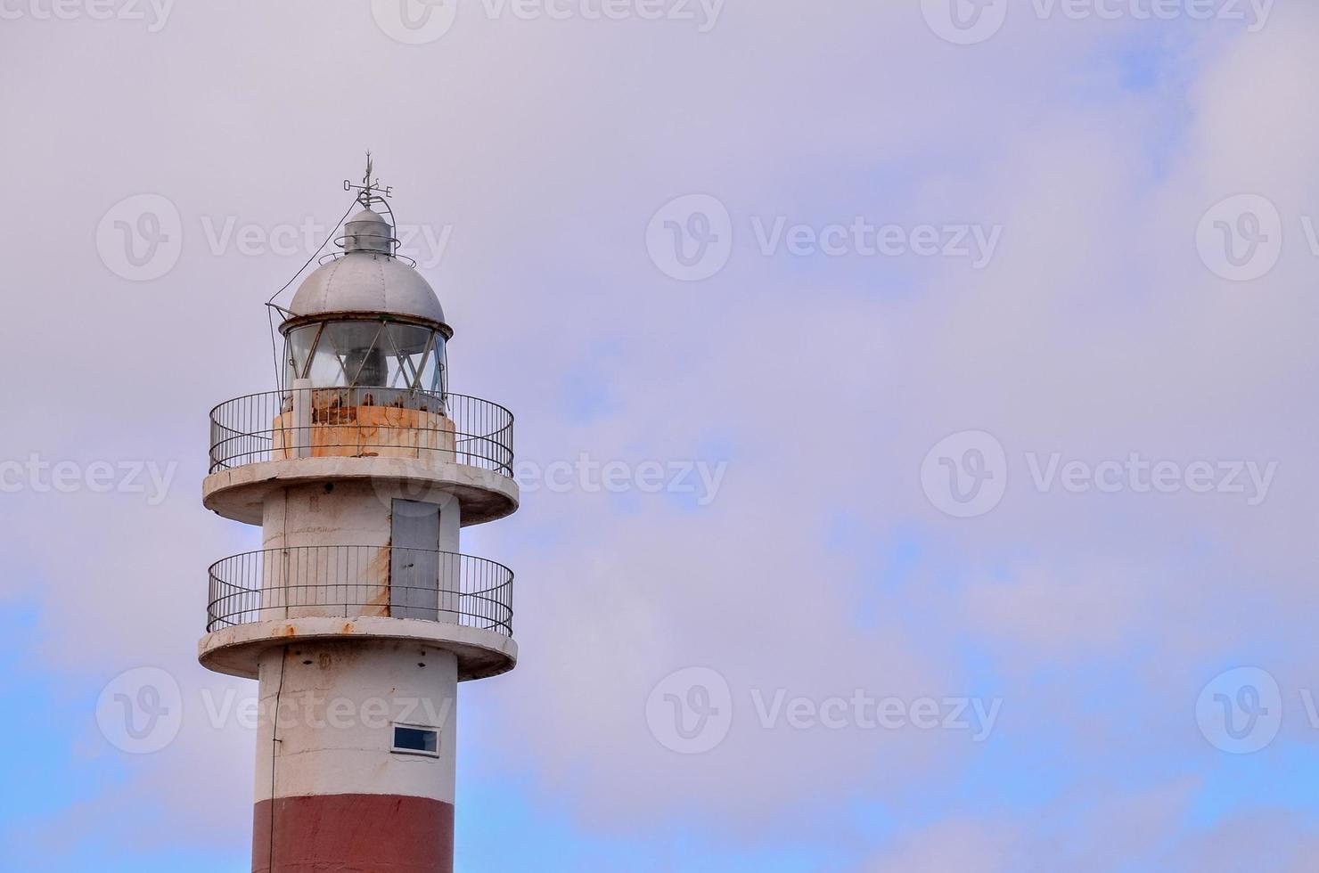 Lighthouse by the sea photo