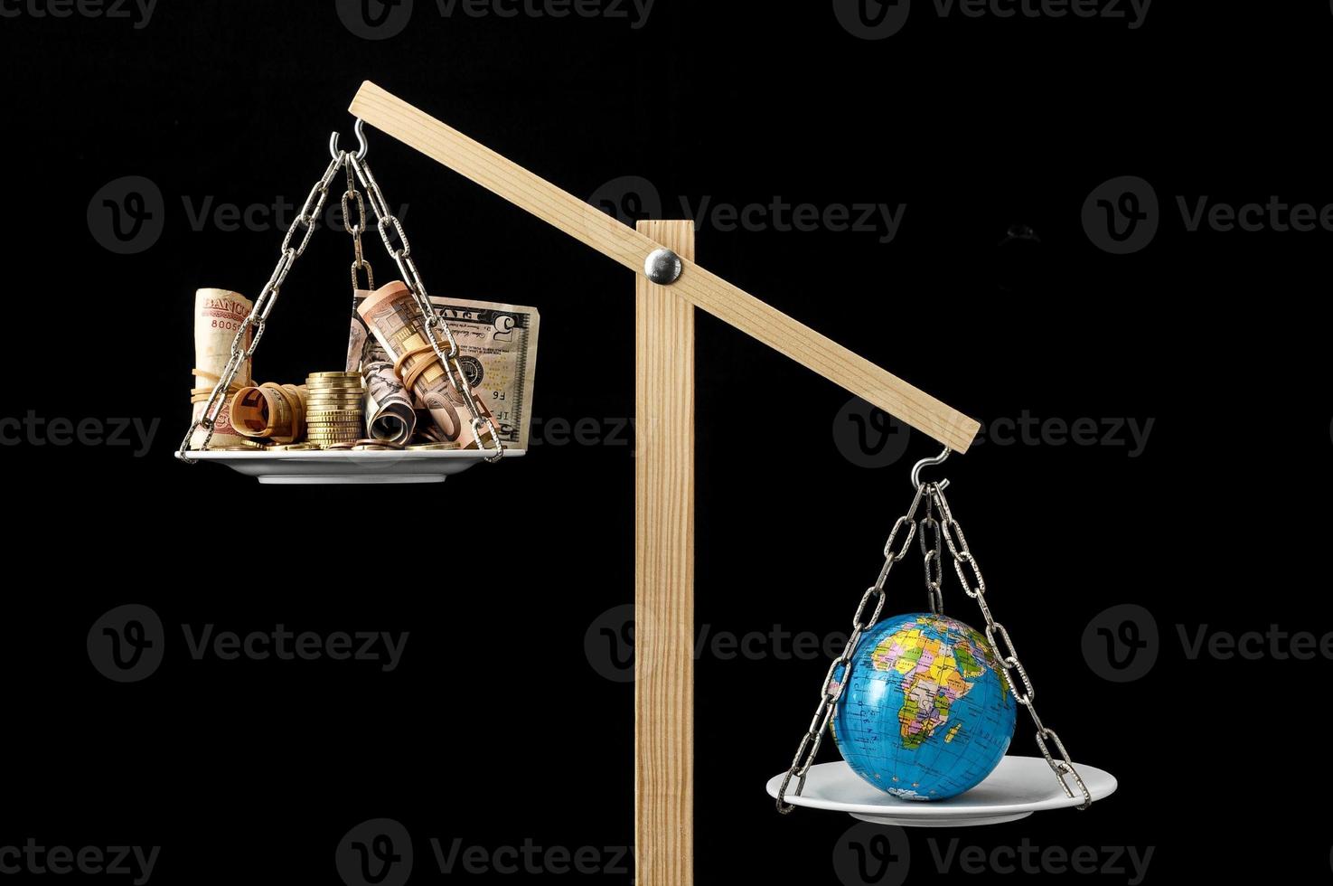 Scale with money and globe photo