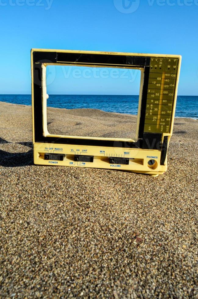 Old tv on beach photo