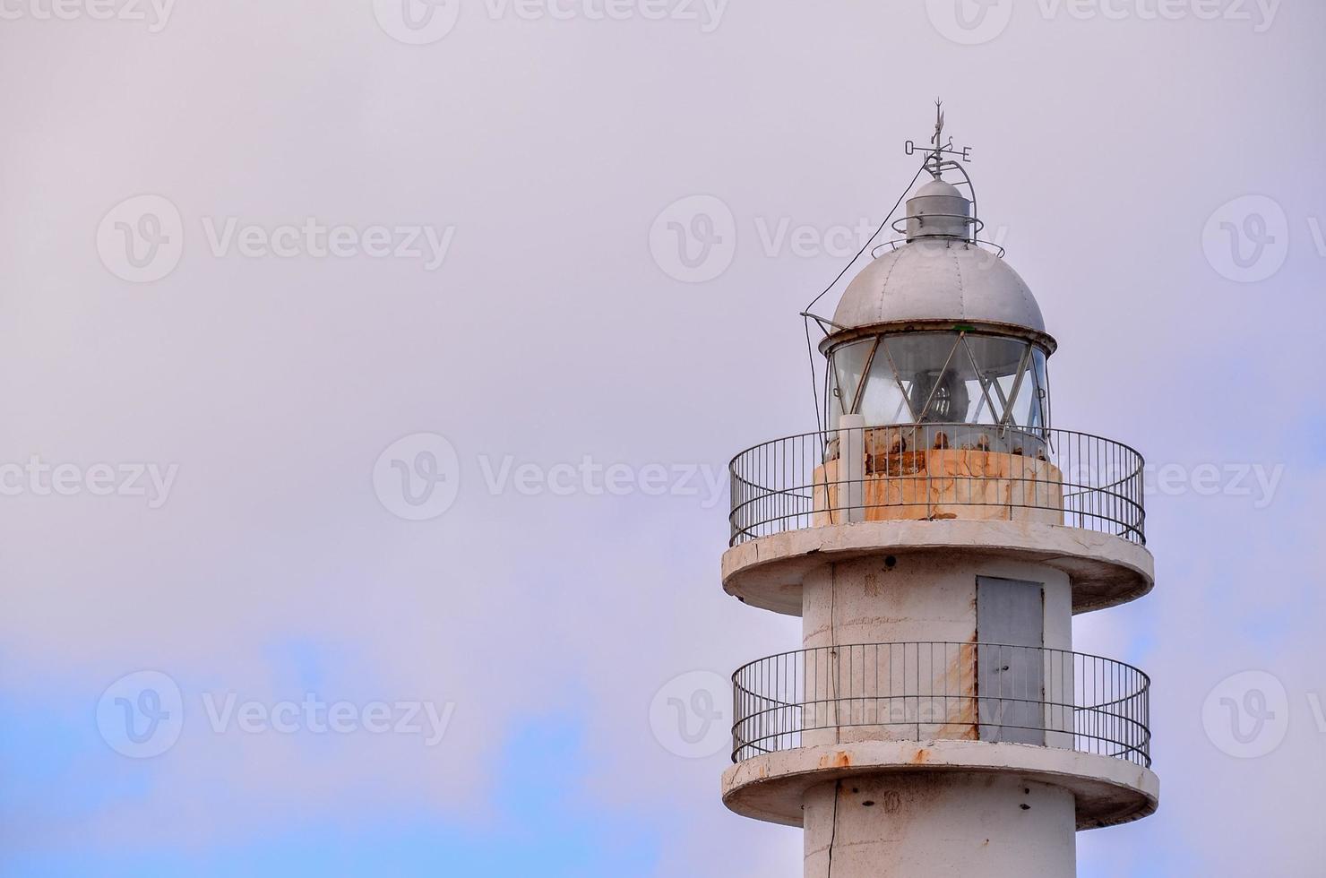 Lighthouse by the sea photo