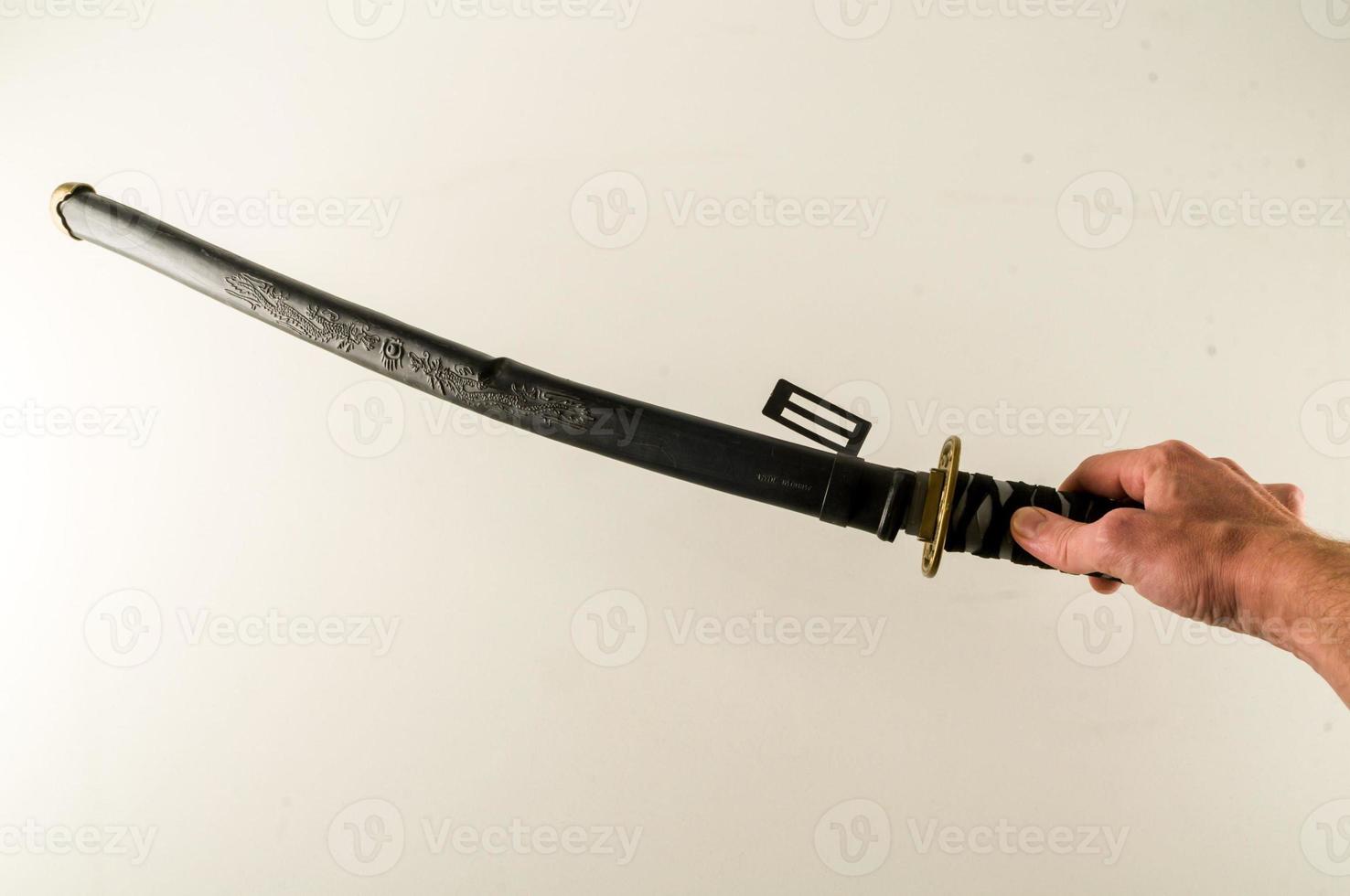 Holding a katana sword photo