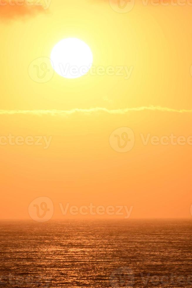 Sunset over the ocean photo