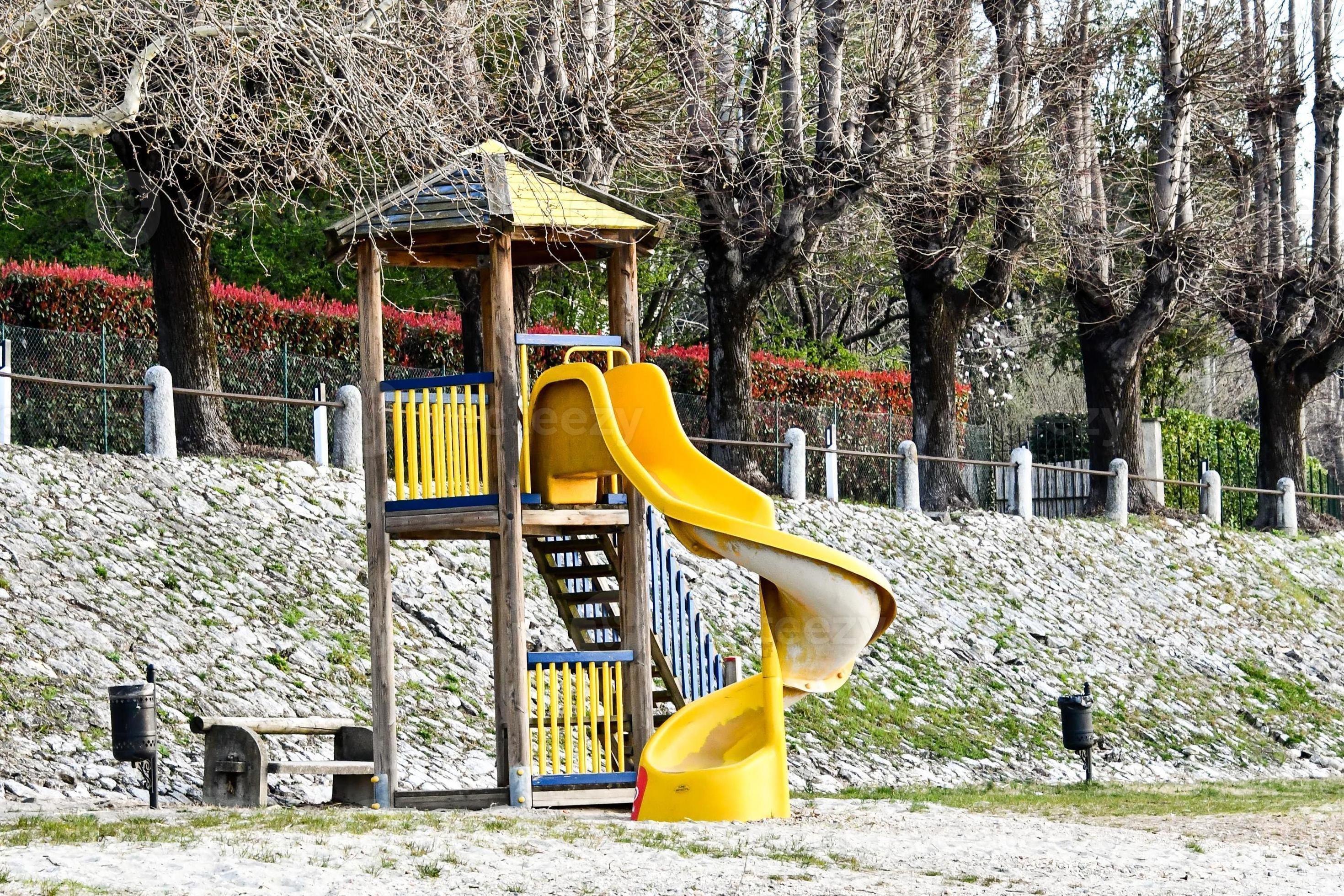Yellow playground slide 14788017 Stock Photo at Vecteezy