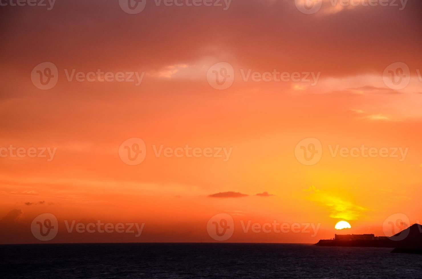 Sunset over the ocean photo
