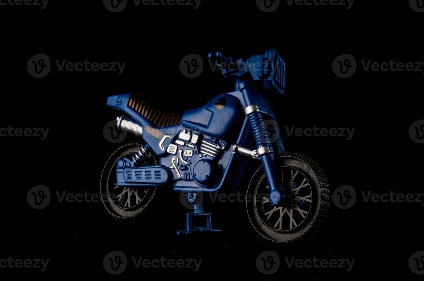 Blue motorcycle on black photo