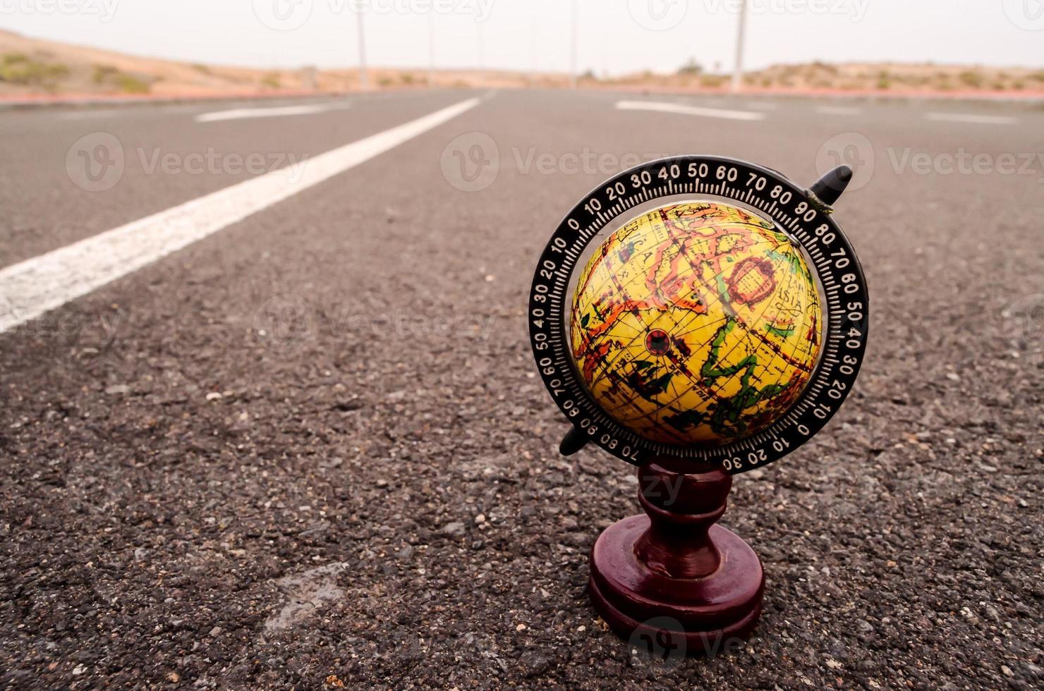Globe on road photo