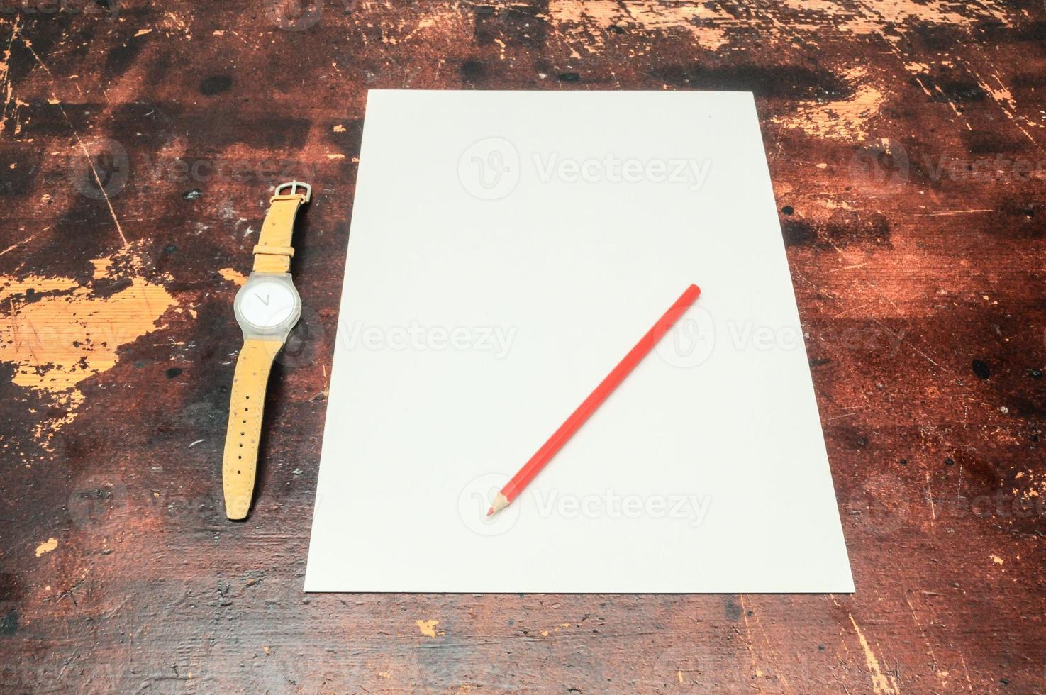 Paper and pencil on the table photo