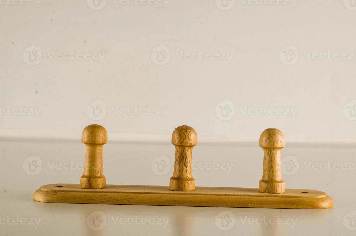 Wooden pegs on table photo