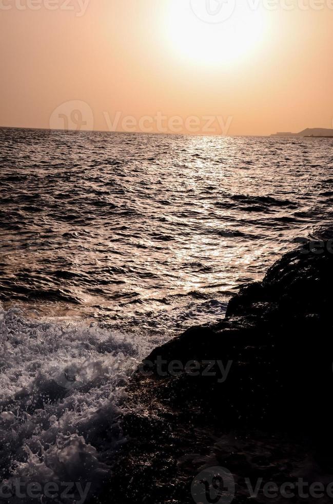 Sunset over the ocean photo