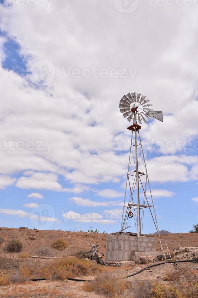 Windmill in desert photo