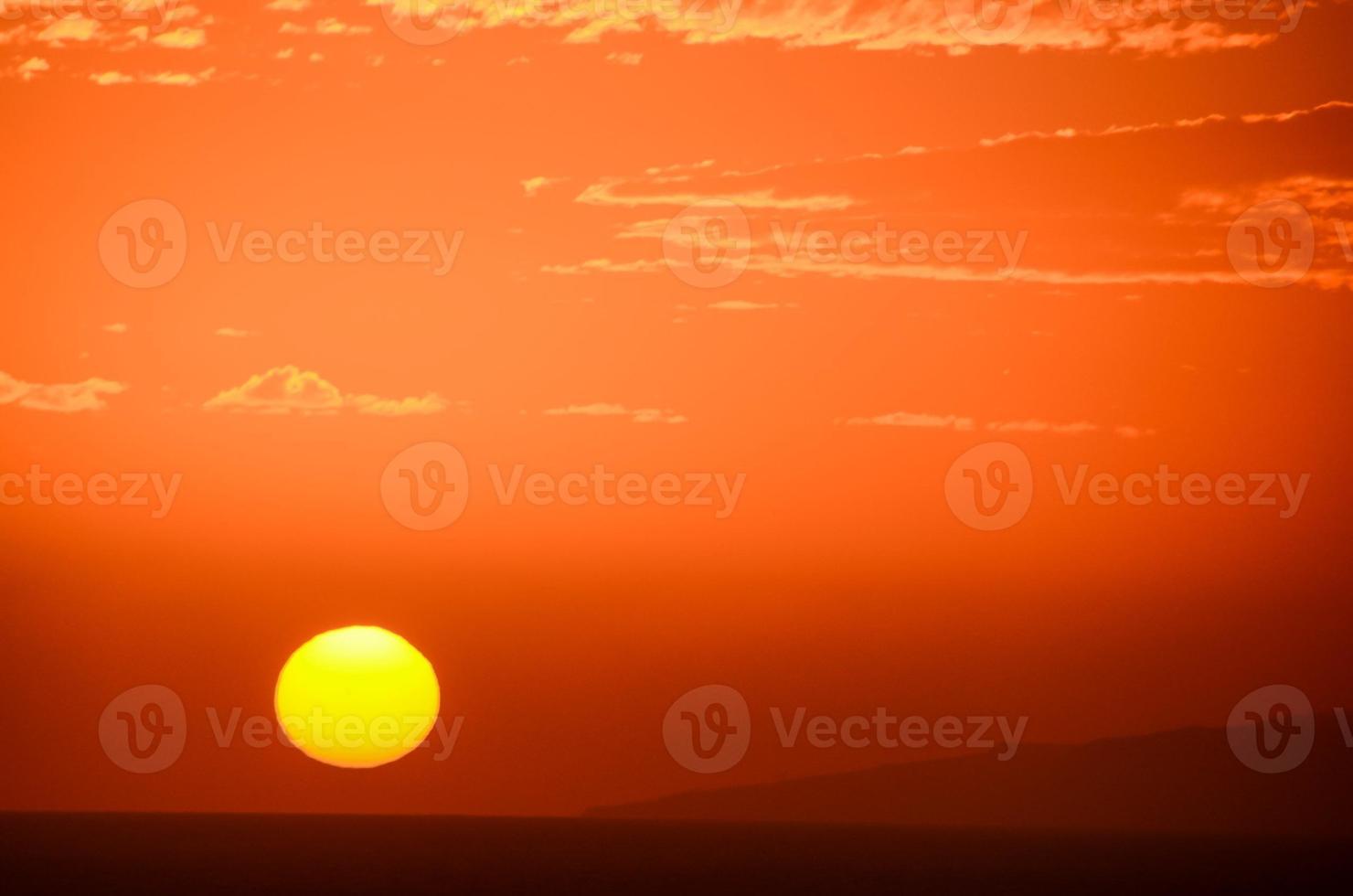 Sunset over the ocean photo