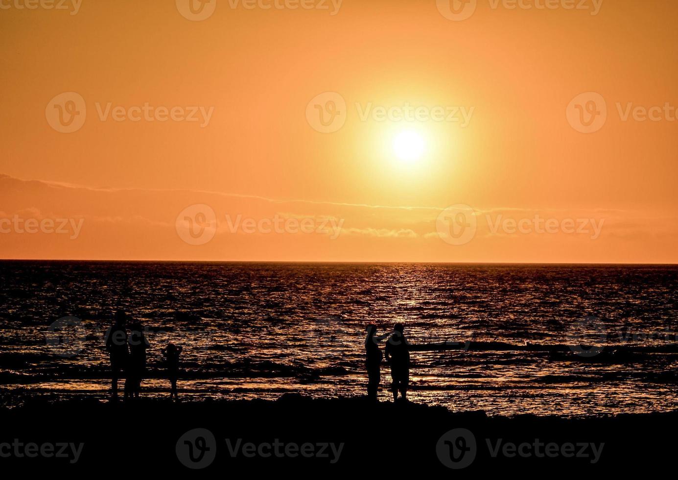 Sunset over the ocean photo