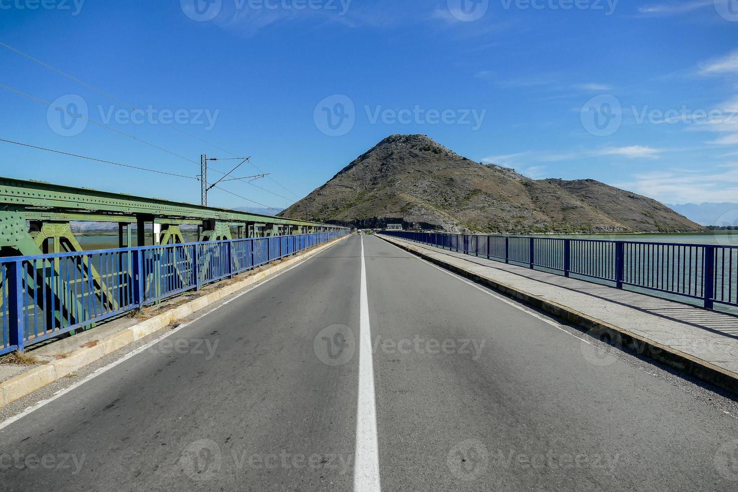 Bridge to mountain photo