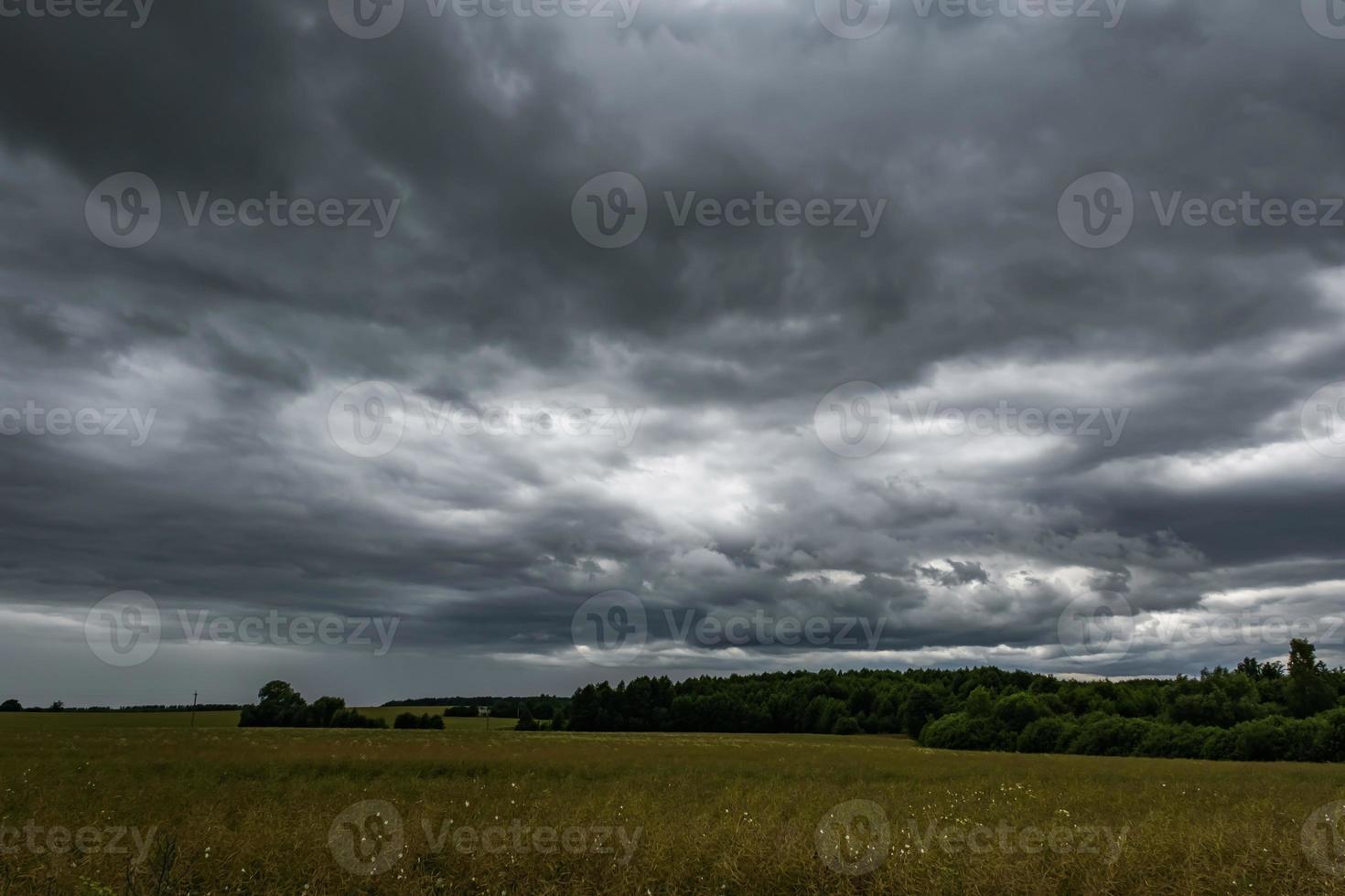panorama of black sky background with storm clouds. thunder front photo